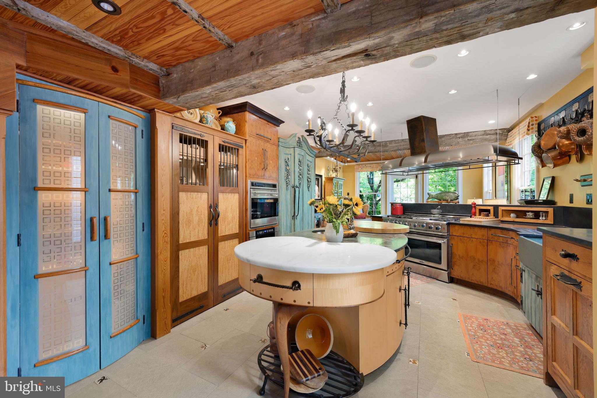 511 Queen Street Alexandria, VA 22314 - Photo 19 of 58 a kitchen with stainless steel appliances granite countertop a sink a stove and a refrigerator