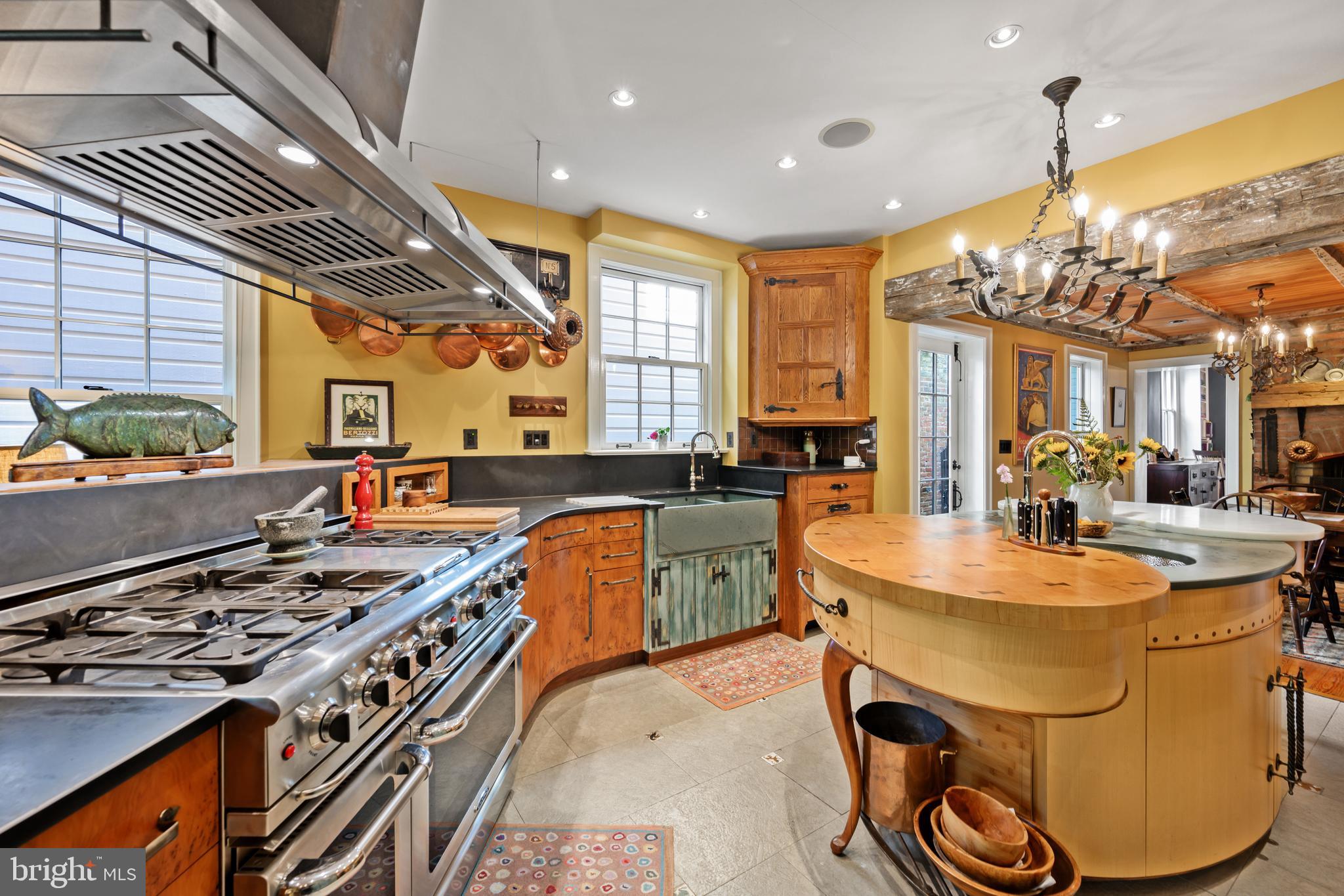 511 Queen Street Alexandria, VA 22314 - Photo 24 of 58 a kitchen with stainless steel appliances granite countertop a stove and a refrigerator