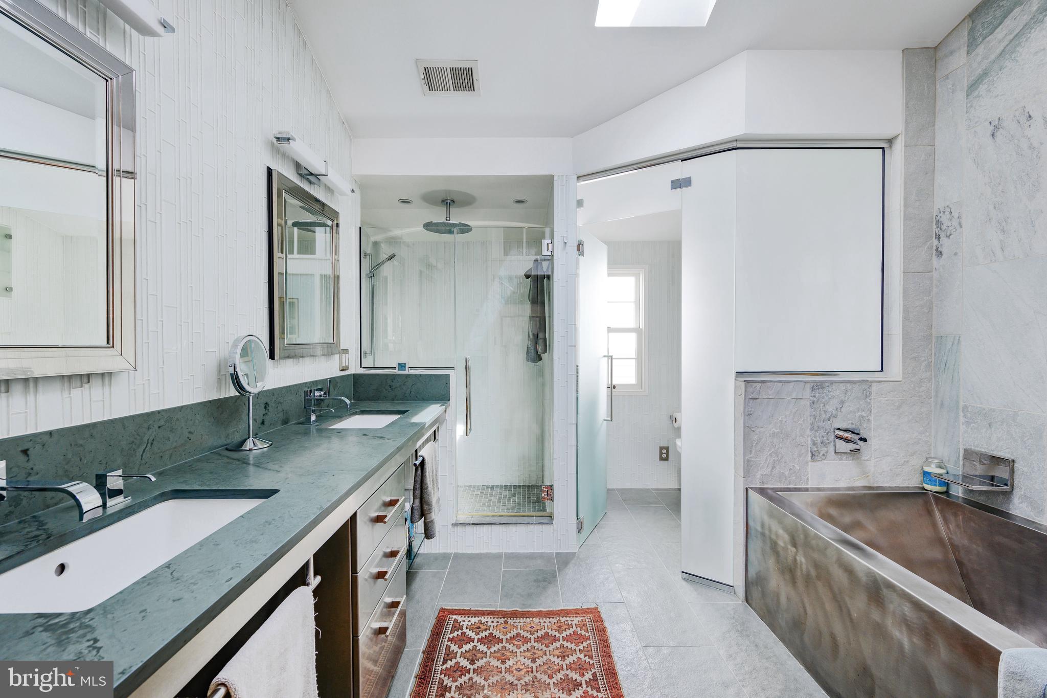 511 Queen Street Alexandria, VA 22314 - Photo 31 of 58 a bathroom with a granite countertop bathtub shower sink and mirror