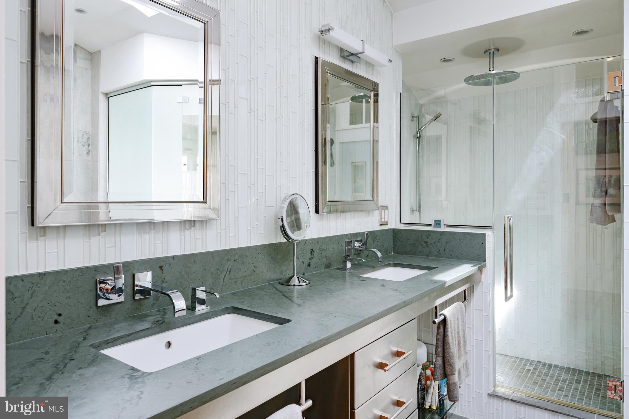 511 Queen Street Alexandria, VA 22314 - Photo 34 of 58 a bathroom with a sink double vanity and a mirror