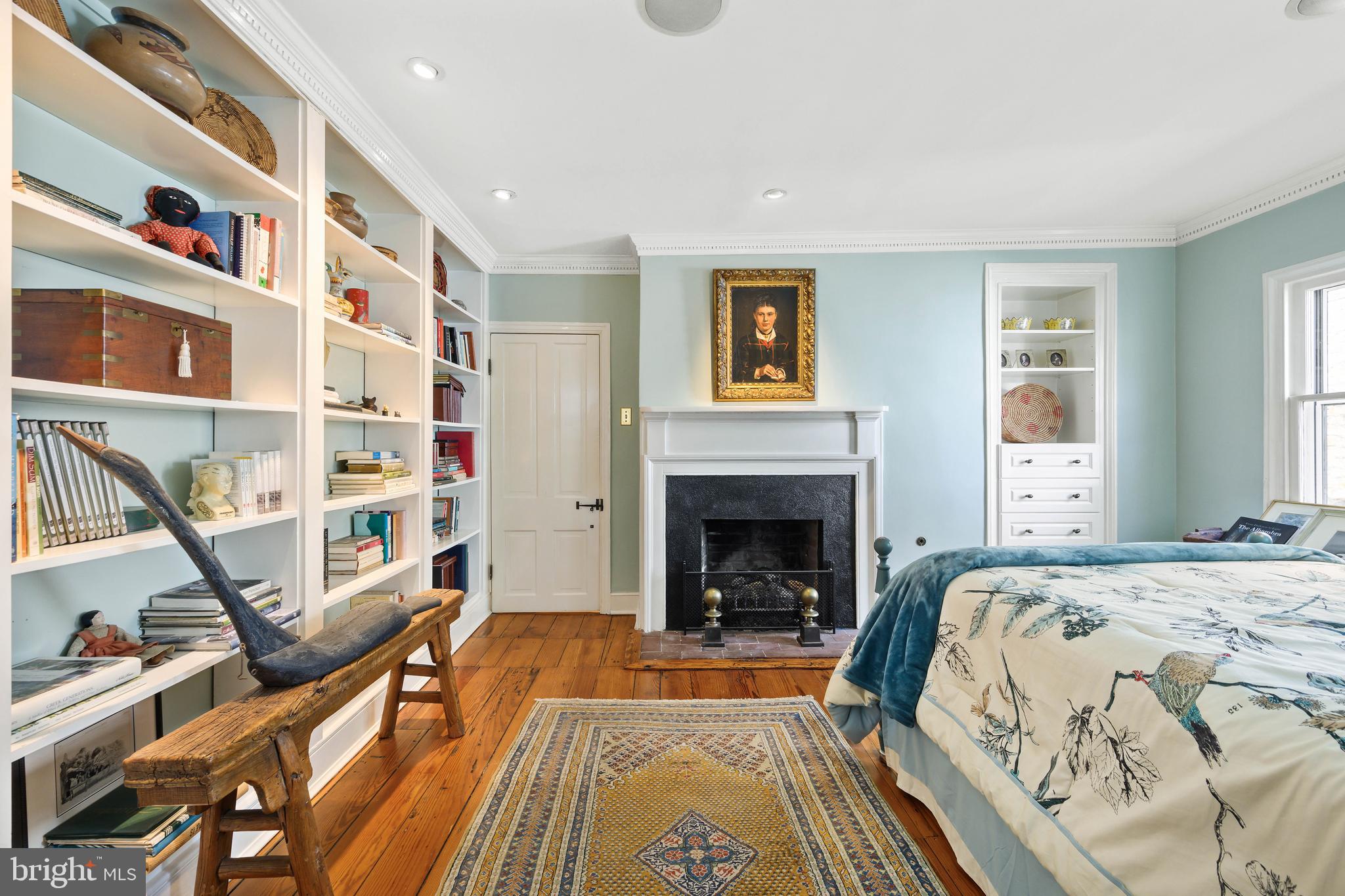 511 Queen Street Alexandria, VA 22314 - Photo 45 of 58 a living room with a bed and a fireplace