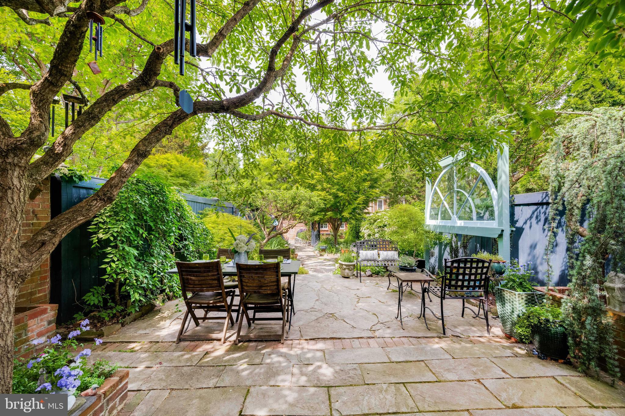 511 Queen Street Alexandria, VA 22314 - Photo 50 of 58 a view of a patio with a table and chairs and potted plants