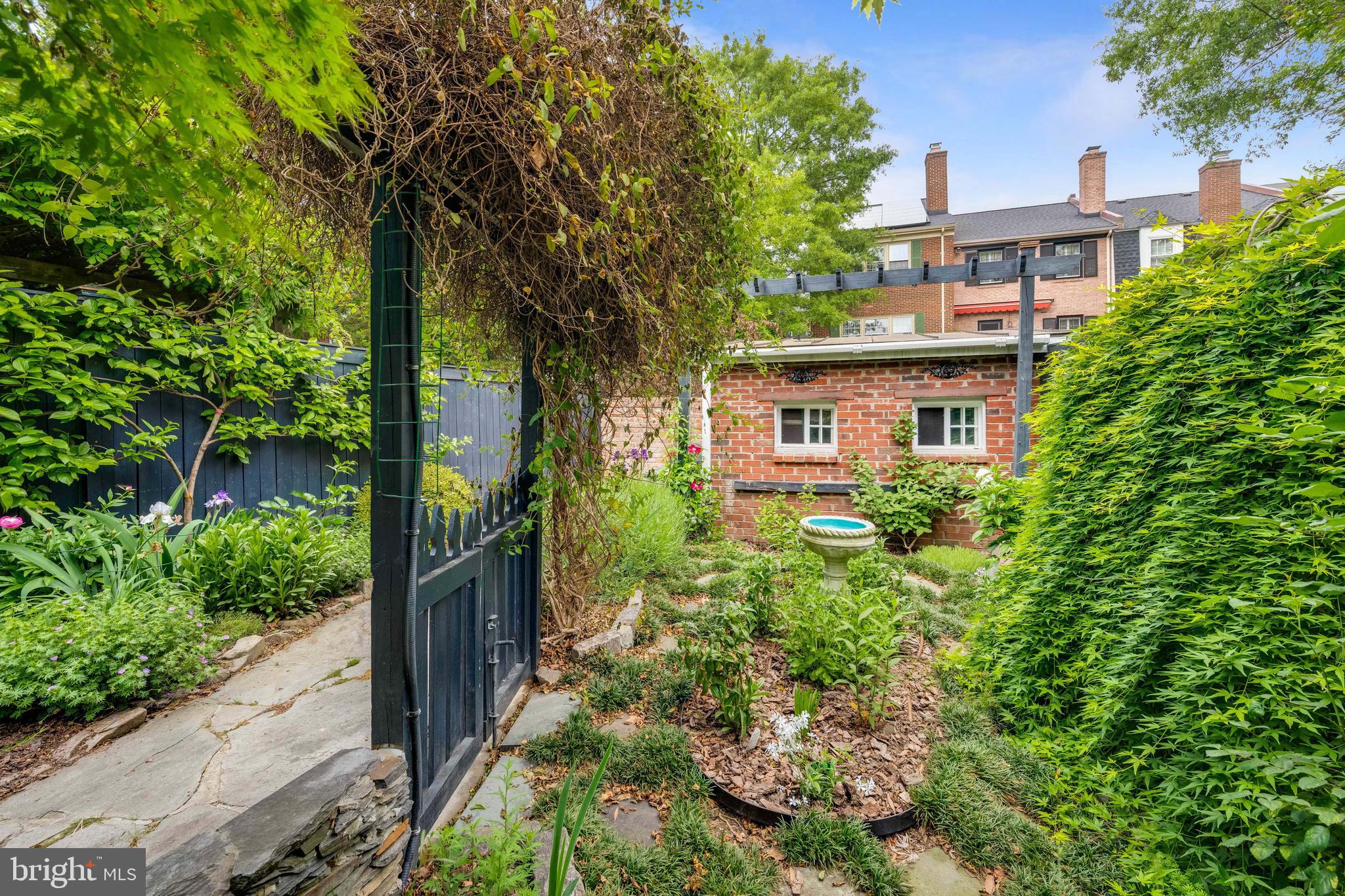 511 Queen Street Alexandria, VA 22314 - Photo 57 of 58 a view of a house with a yard and plants