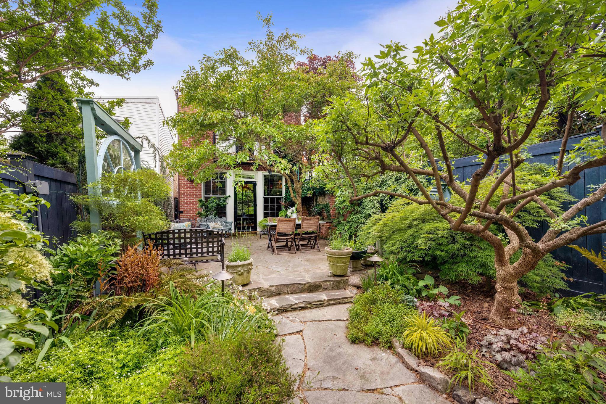 511 Queen Street Alexandria, VA 22314 - Photo 58 of 58 a view of a patio with table and chairs and potted plants
