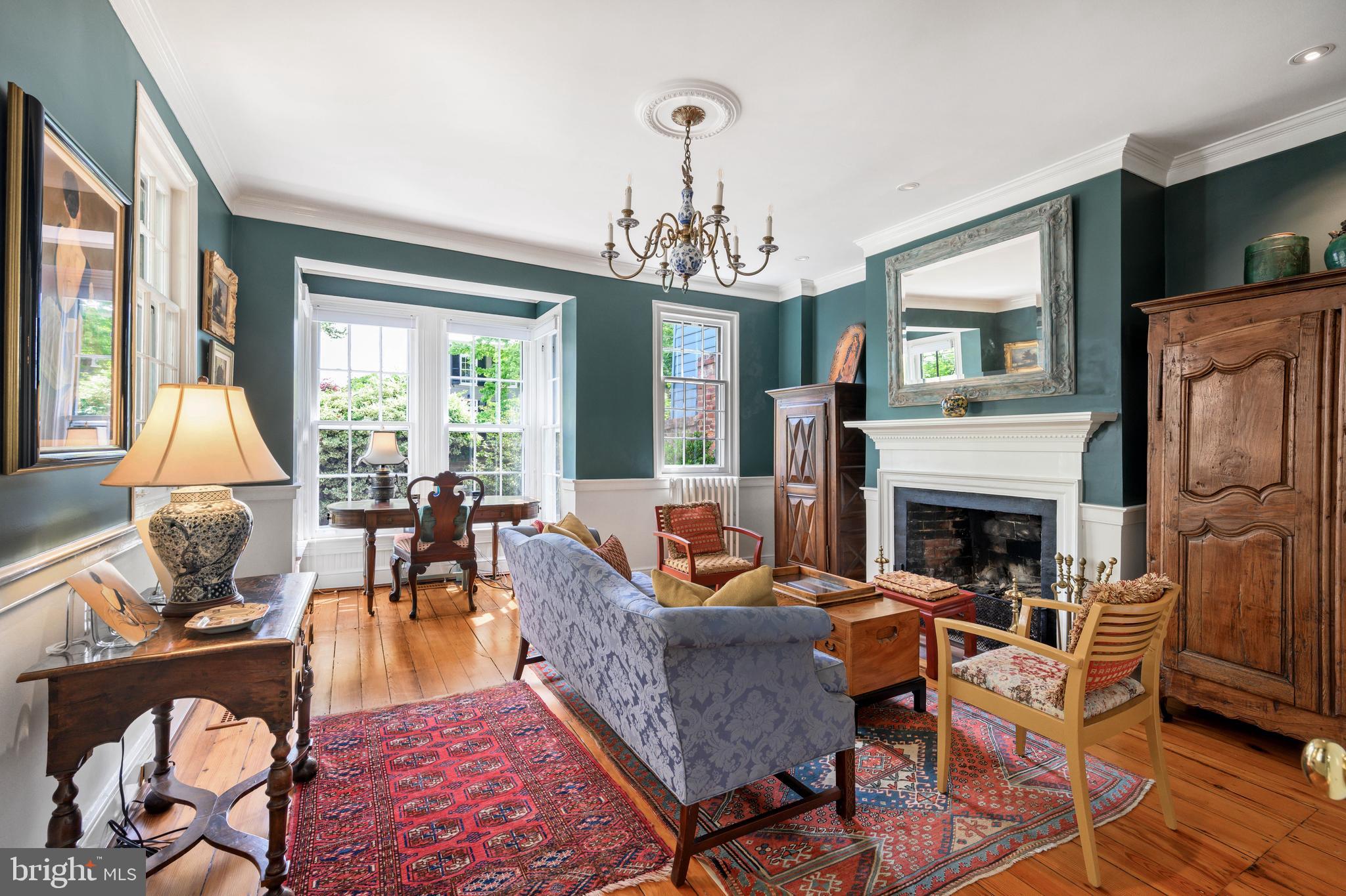 511 Queen Street Alexandria, VA 22314 - Photo 10 of 58 a living room with furniture a fireplace and a large window