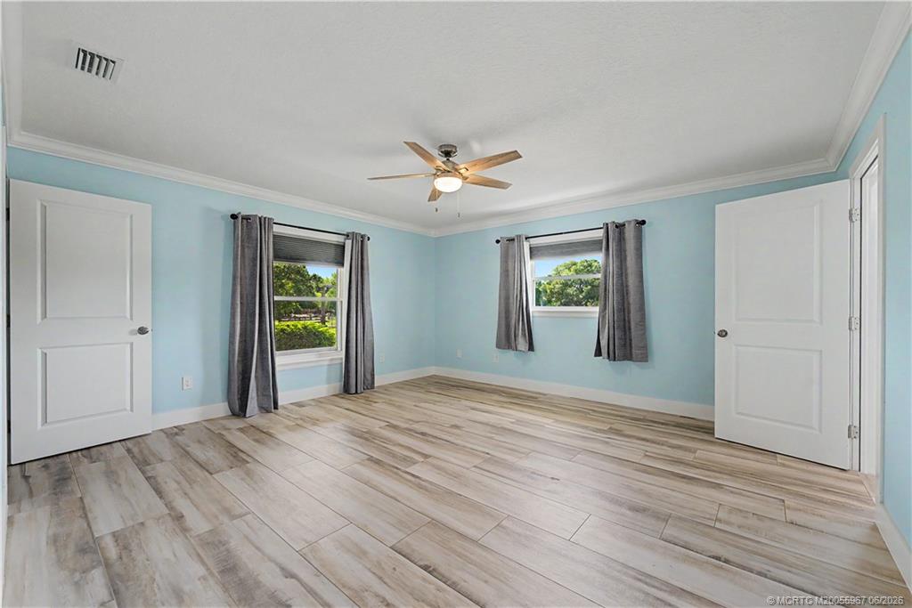 8200 Southwest Springhaven Avenue Indiantown, FL 34956 - Photo 23 of 35 a view of a livingroom with a window and wooden floor