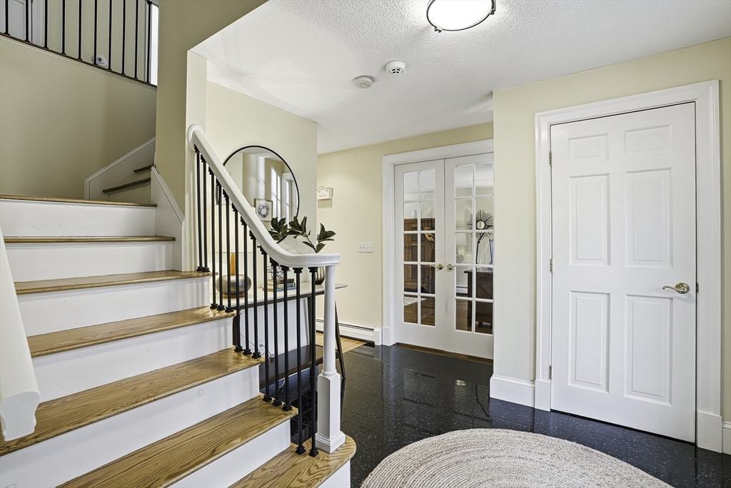6 Hickory Lane Upton, MA 01568 - Photo 11 of 36 a living room with wooden floor furniture and a window