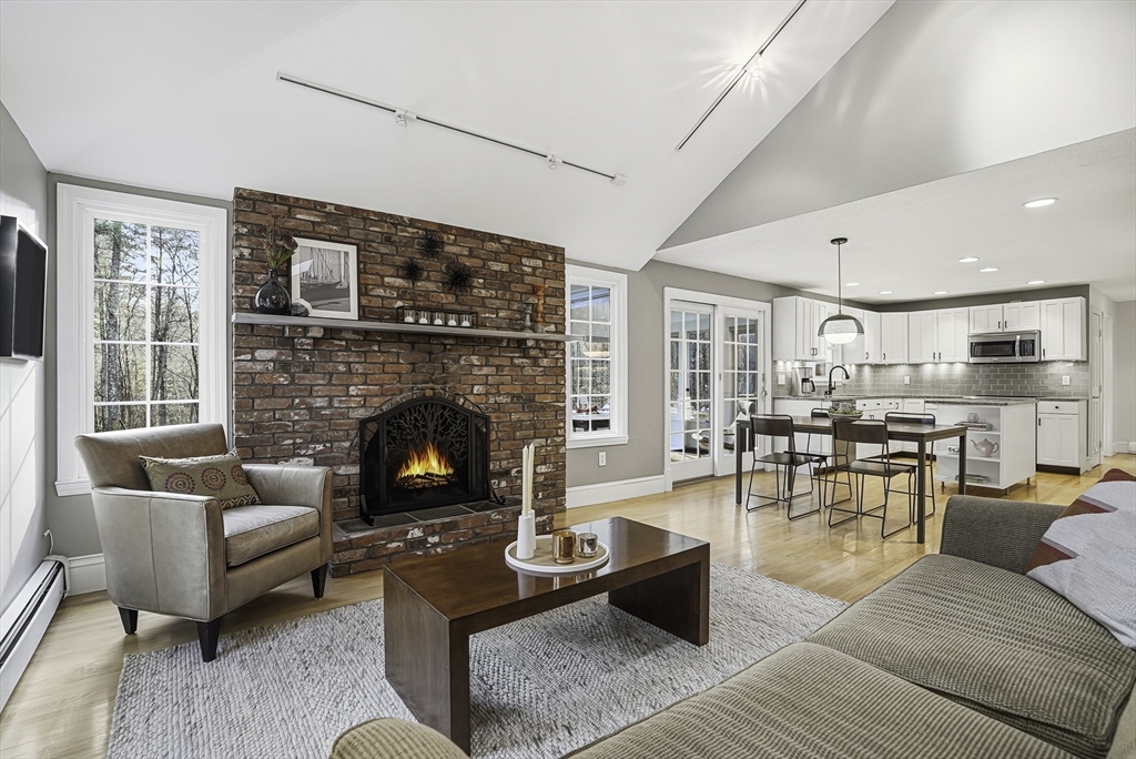 6 Hickory Lane Upton, MA 01568 - Photo 19 of 36 a living room with furniture and a fireplace