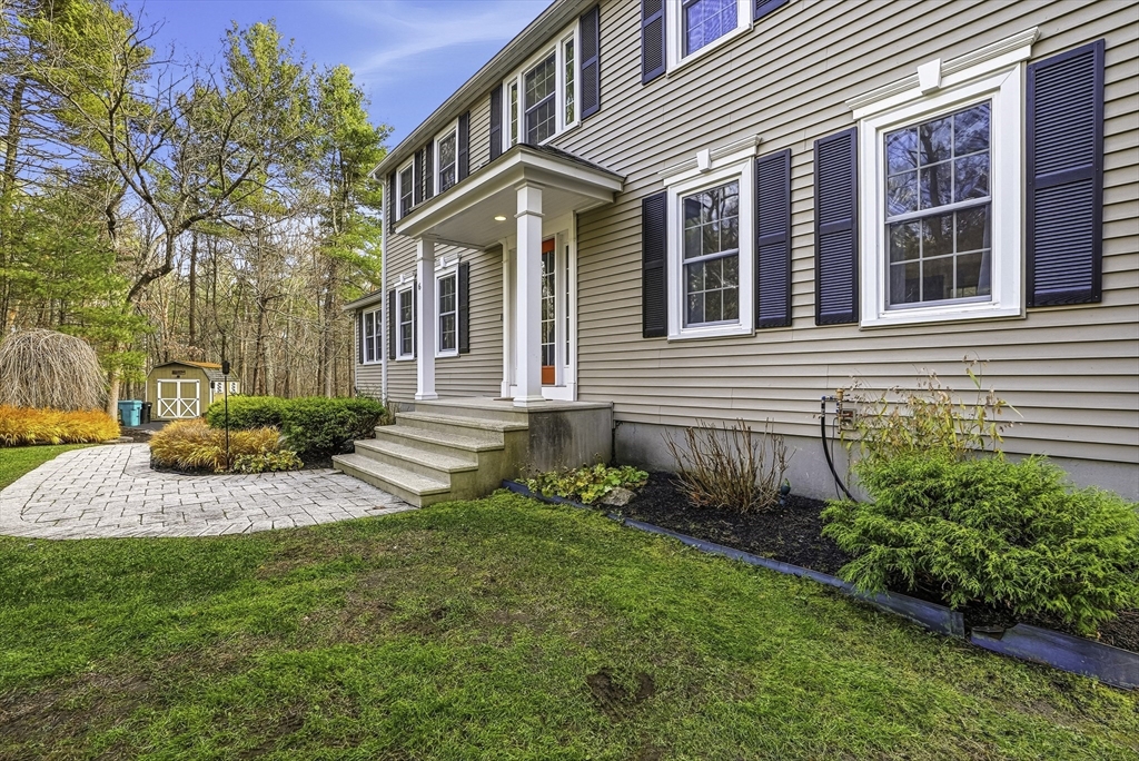 6 Hickory Lane Upton, MA 01568 - Photo 2 of 36 a front view of a house with a yard