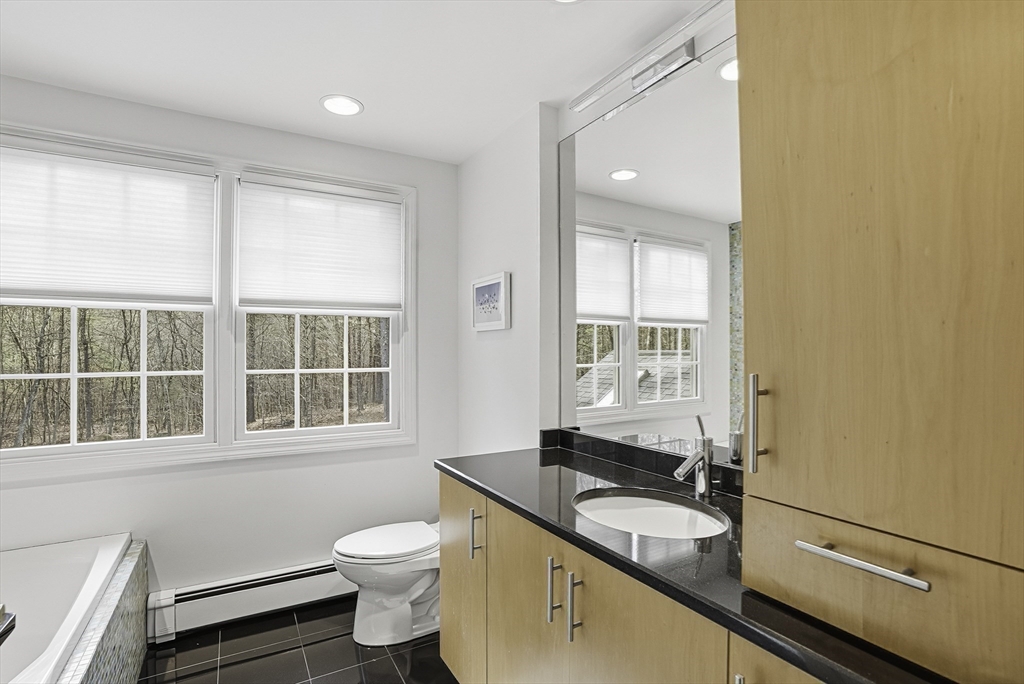 6 Hickory Lane Upton, MA 01568 - Photo 30 of 36 a bathroom with a granite countertop sink toilet a mirror and a tub