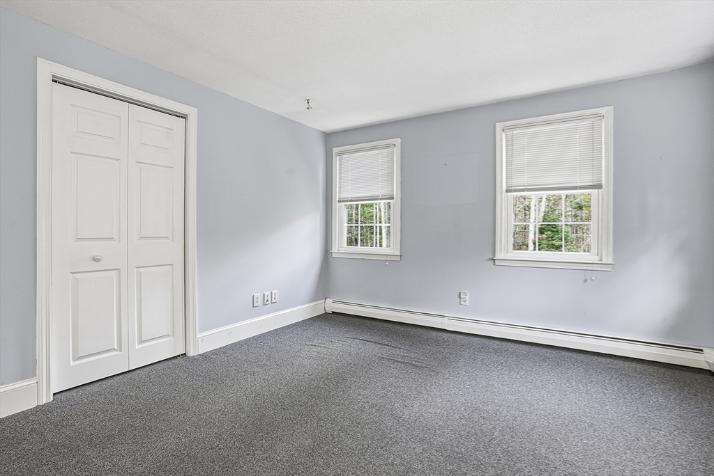6 Hickory Lane Upton, MA 01568 - Photo 33 of 36 an empty room with windows