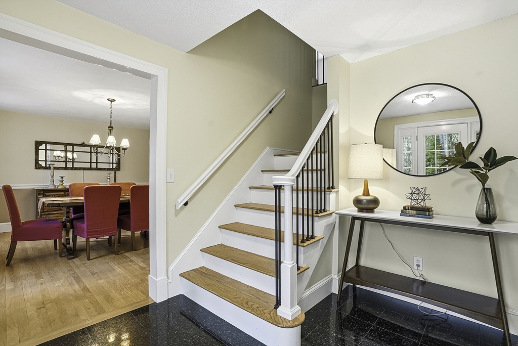 6 Hickory Lane Upton, MA 01568 - Photo 10 of 36 a view of a livingroom with furniture a couch and wooden floor