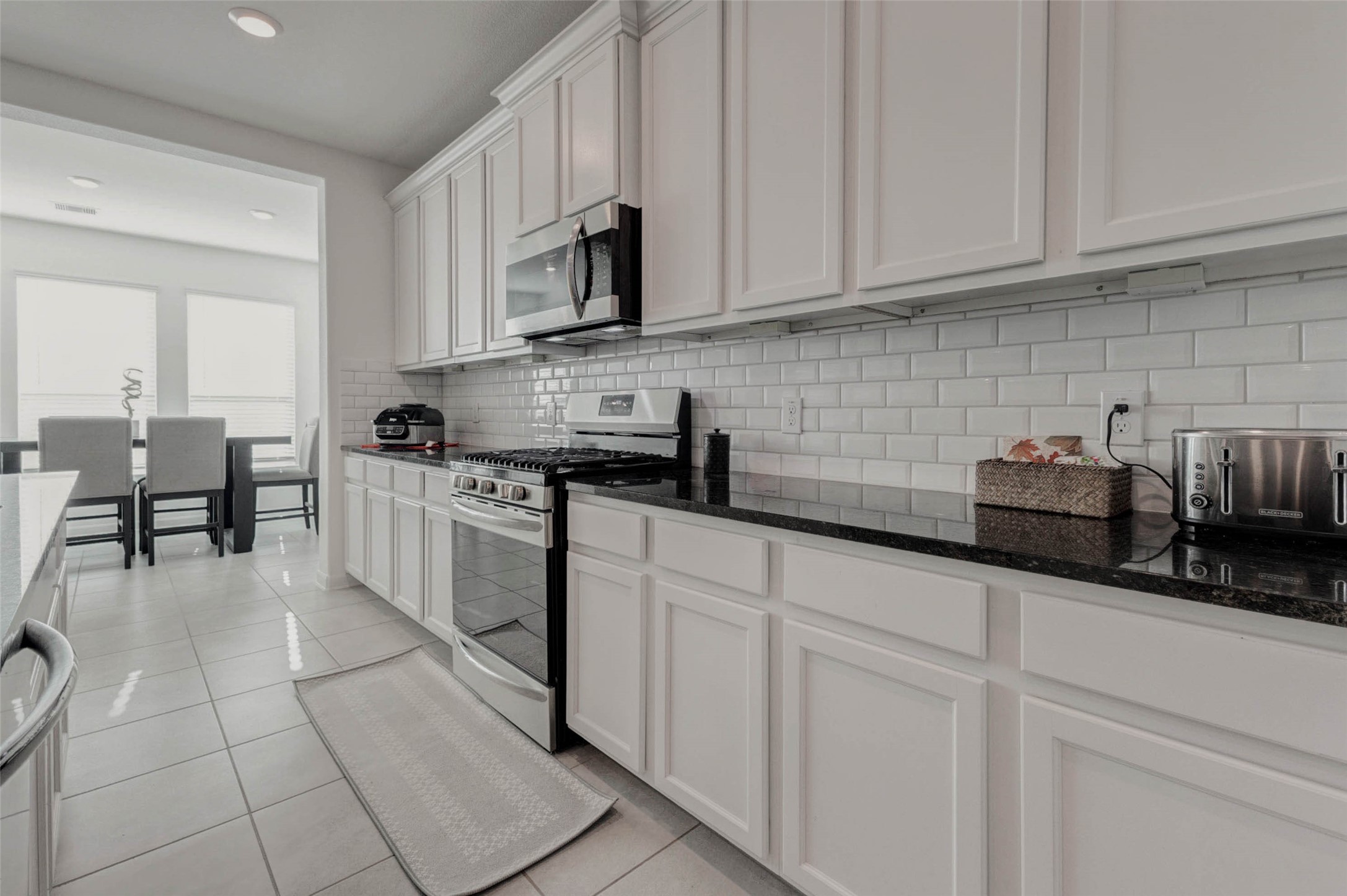 3711 Castle Rock Drive Rosenberg, TX 77469 - Photo 15 of 46 a kitchen with stainless steel appliances granite countertop a sink a stove and cabinets