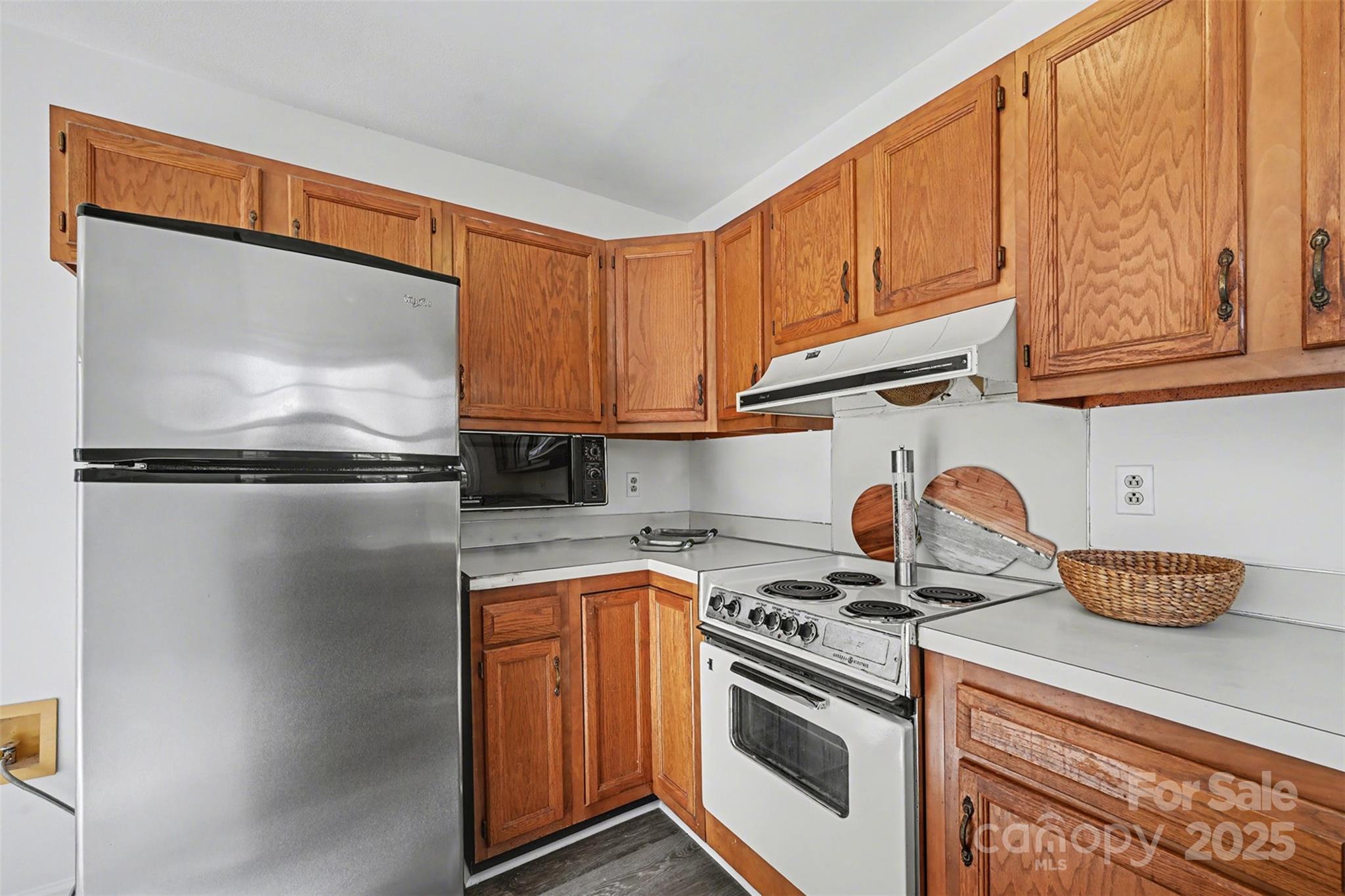 2730 Quailrush Road Charlotte, NC 28226 - Photo 11 of 22 a kitchen with granite countertop a white stove top oven and cabinets