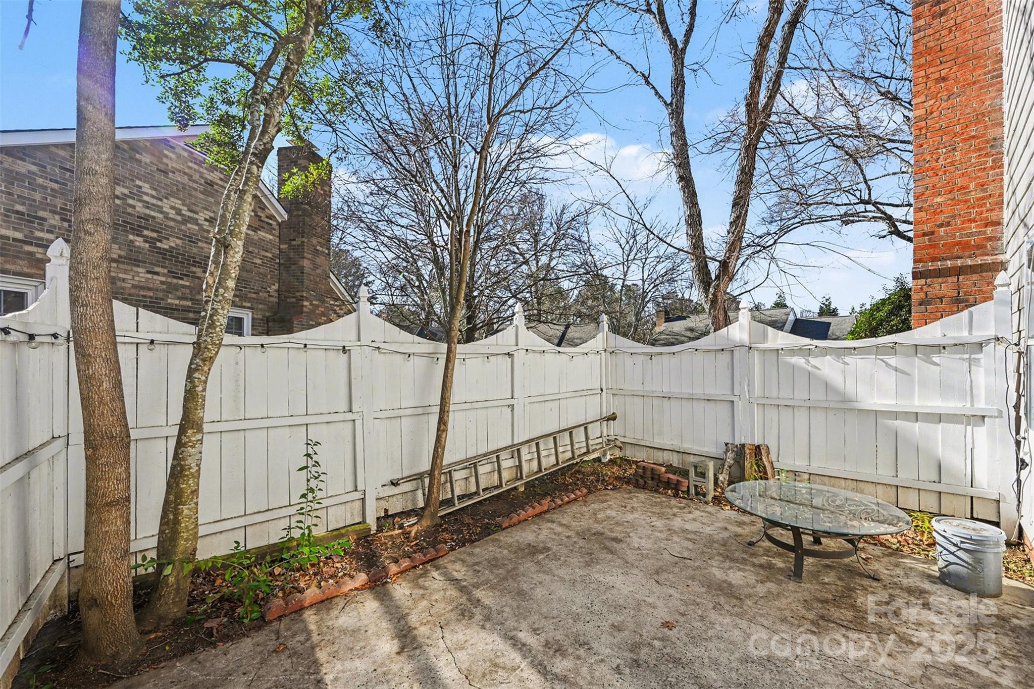 2730 Quailrush Road Charlotte, NC 28226 - Photo 21 of 22 a view of a backyard with a wooden fence and a bench