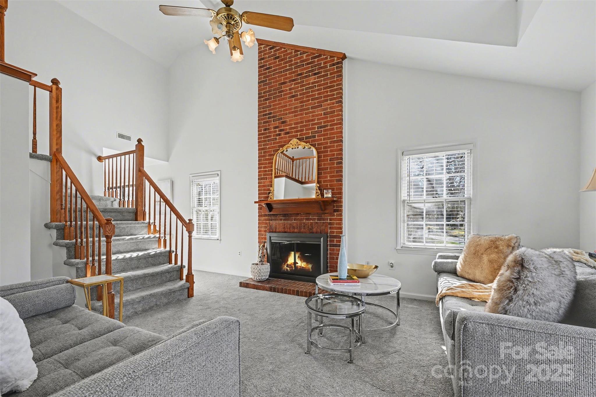 2730 Quailrush Road Charlotte, NC 28226 - Photo 3 of 22 a living room with furniture and a fireplace