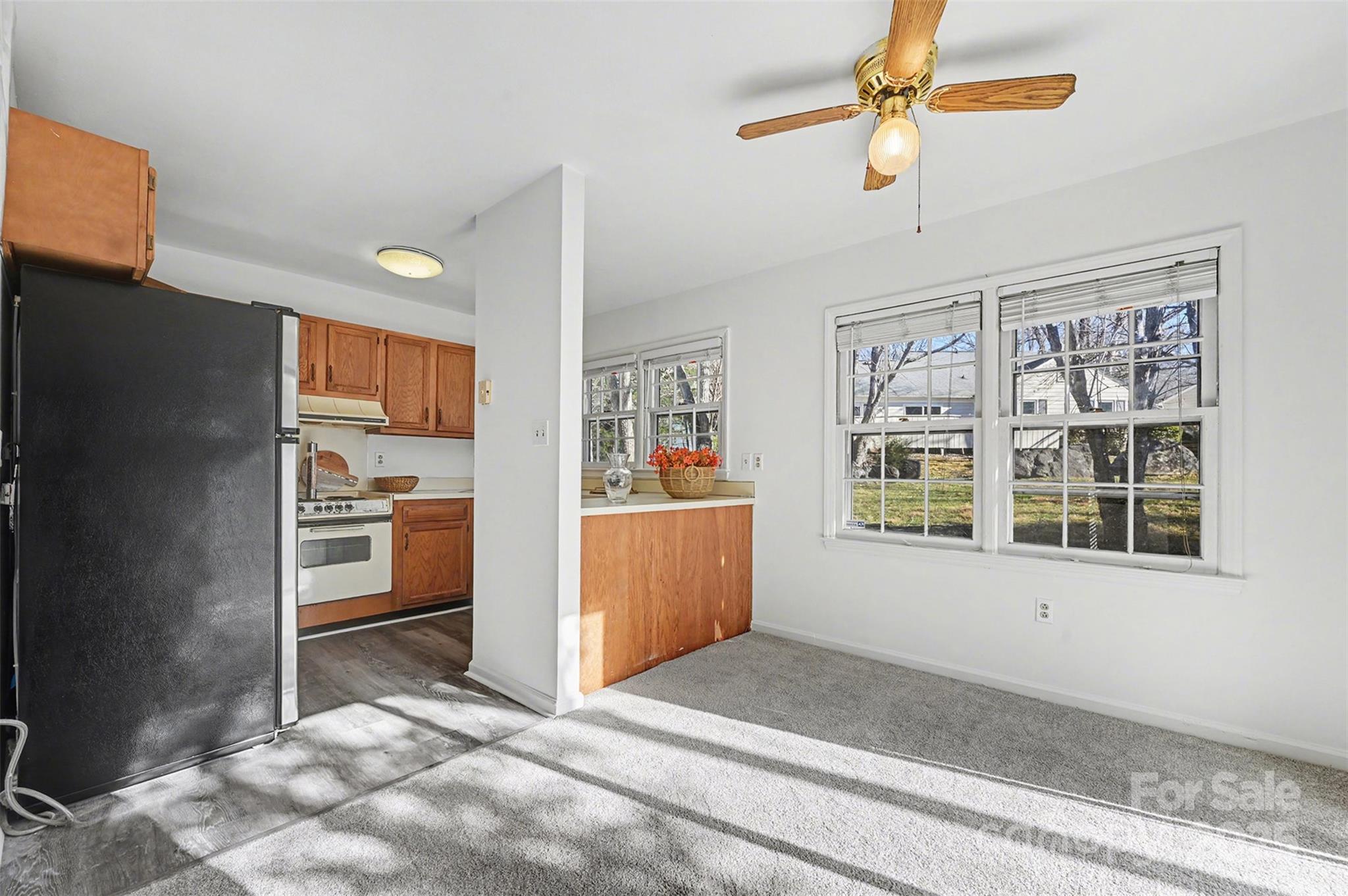2730 Quailrush Road Charlotte, NC 28226 - Photo 9 of 22 a view of a kitchen with furniture and windows
