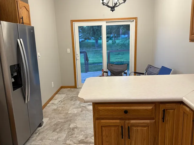 a view of a kitchen from the hallway