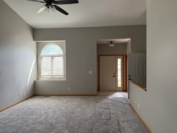 a view of an empty room with a window