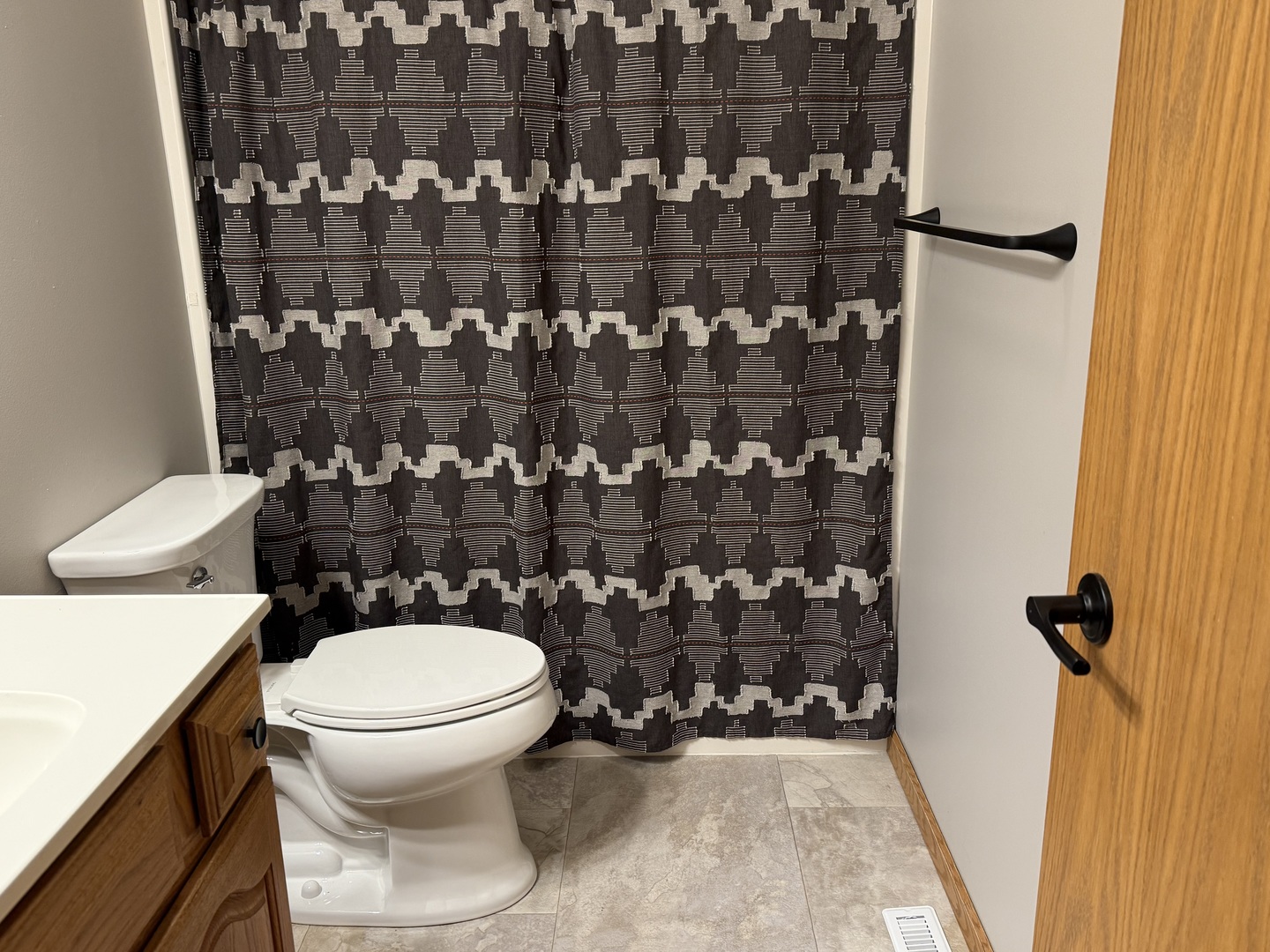 311 West Franklin Street Princeton, IL 61356 - Photo 10 of 19 a bathroom with a toilet and a shower curtain