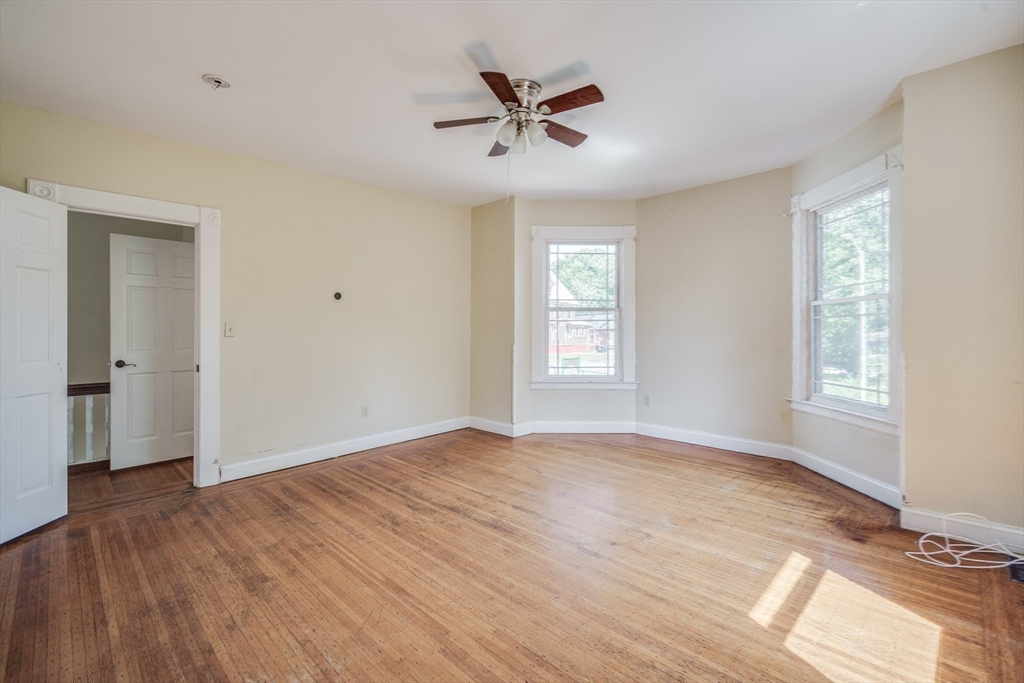 92 Mill Street Springfield, MA 01108 - Photo 15 of 35 wooden floor in an empty room with a window