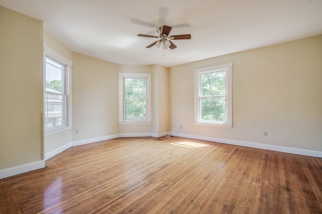 92 Mill Street Springfield, MA 01108 - Photo 16 of 35 wooden floor in an empty room with a window