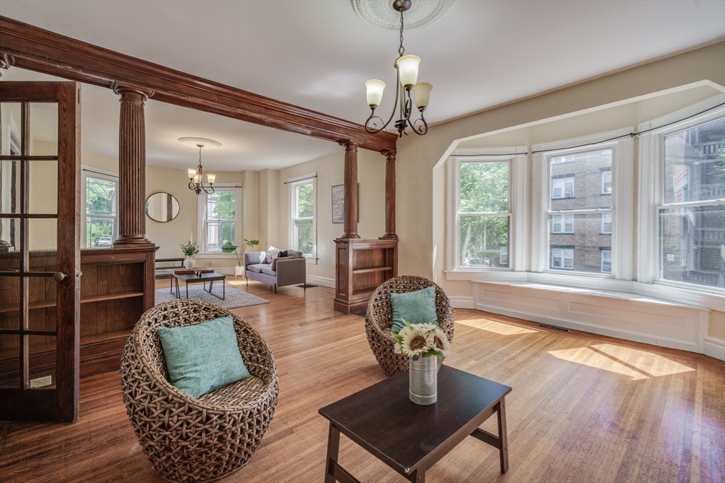 92 Mill Street Springfield, MA 01108 - Photo 9 of 35 a living room with furniture a window and a chandelier