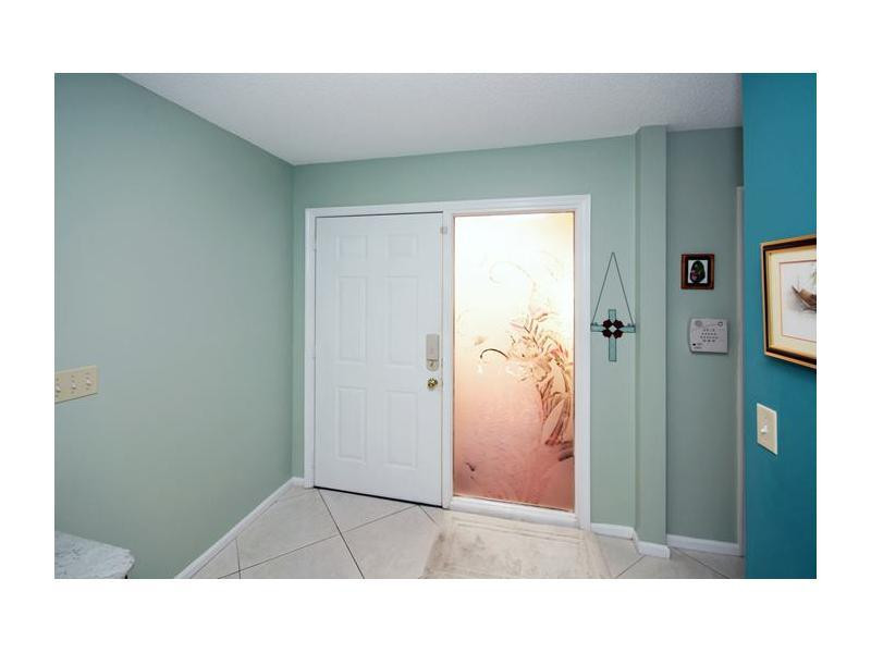 19972 Mona Circle, Unit 19972 Boca Raton, FL 33434 - Photo 3 of 22 a bathroom with a sink and a mirror
