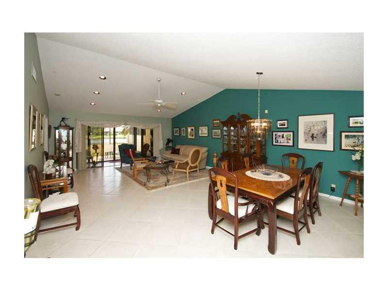19972 Mona Circle, Unit 19972 Boca Raton, FL 33434 - Photo 9 of 22 a living room with furniture and a wooden floor