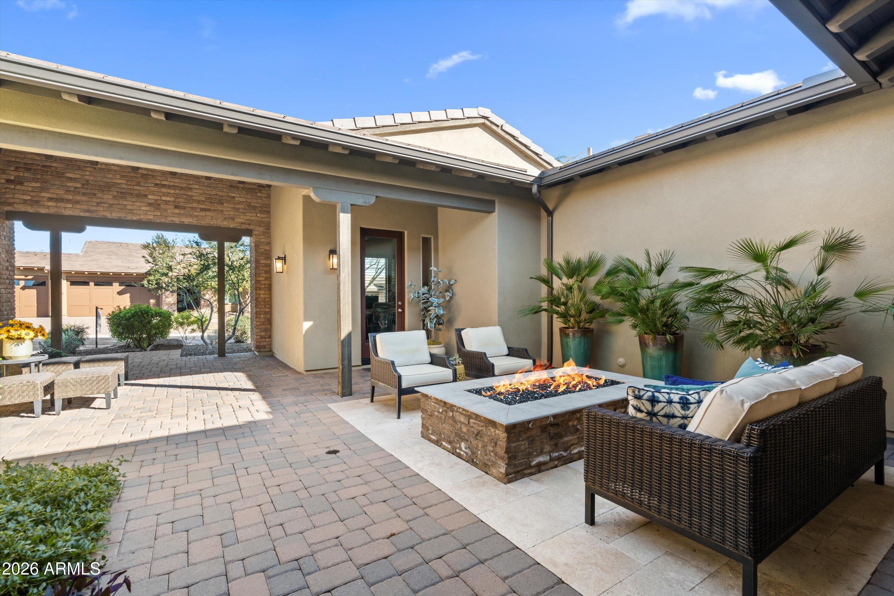 17907 East Slide Rock Drive Rio Verde, AZ 85263 - Photo 12 of 82 a outdoor living space with furniture and a potted plant
