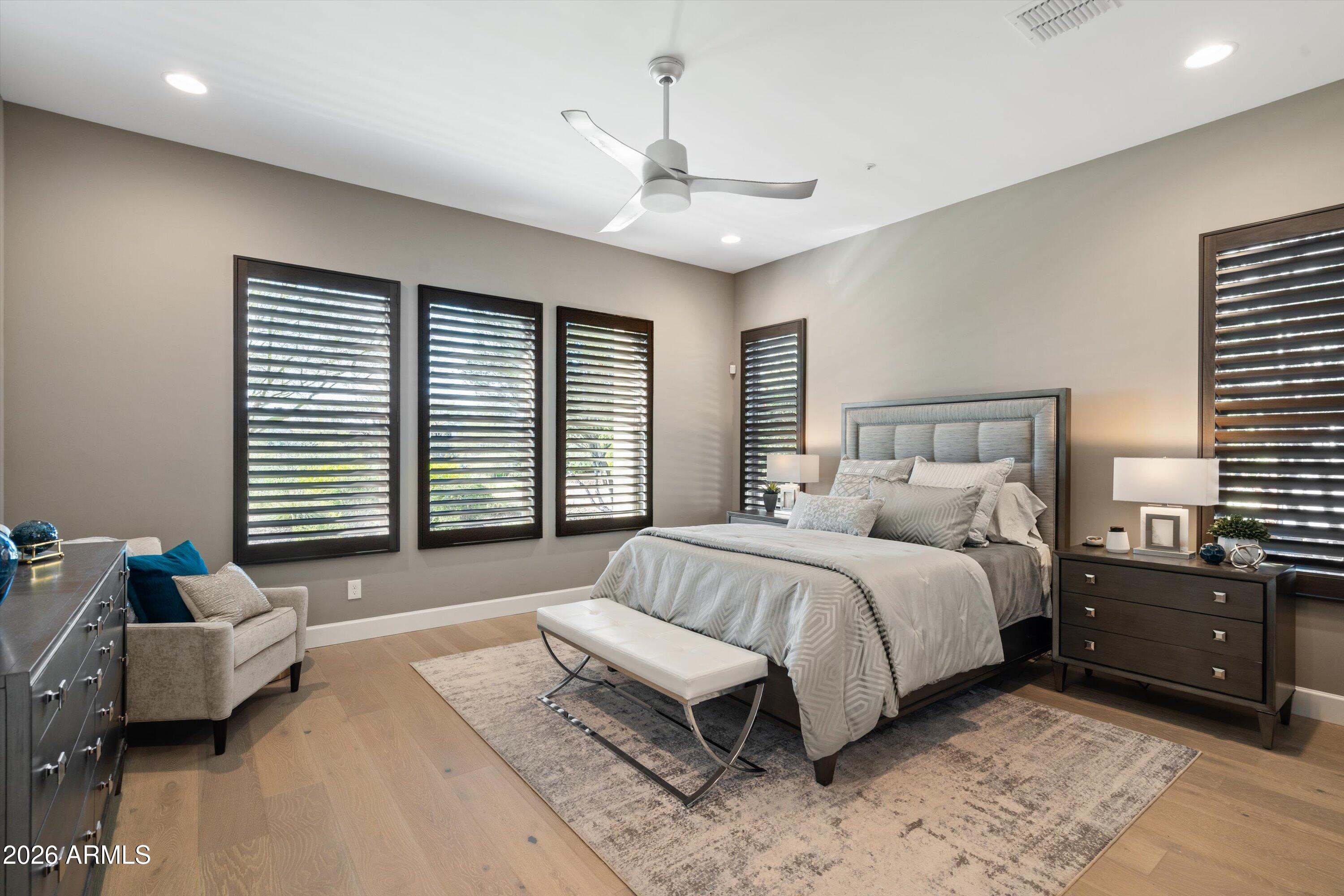 17907 East Slide Rock Drive Rio Verde, AZ 85263 - Photo 32 of 82 a spacious bedroom with a bed and a couch
