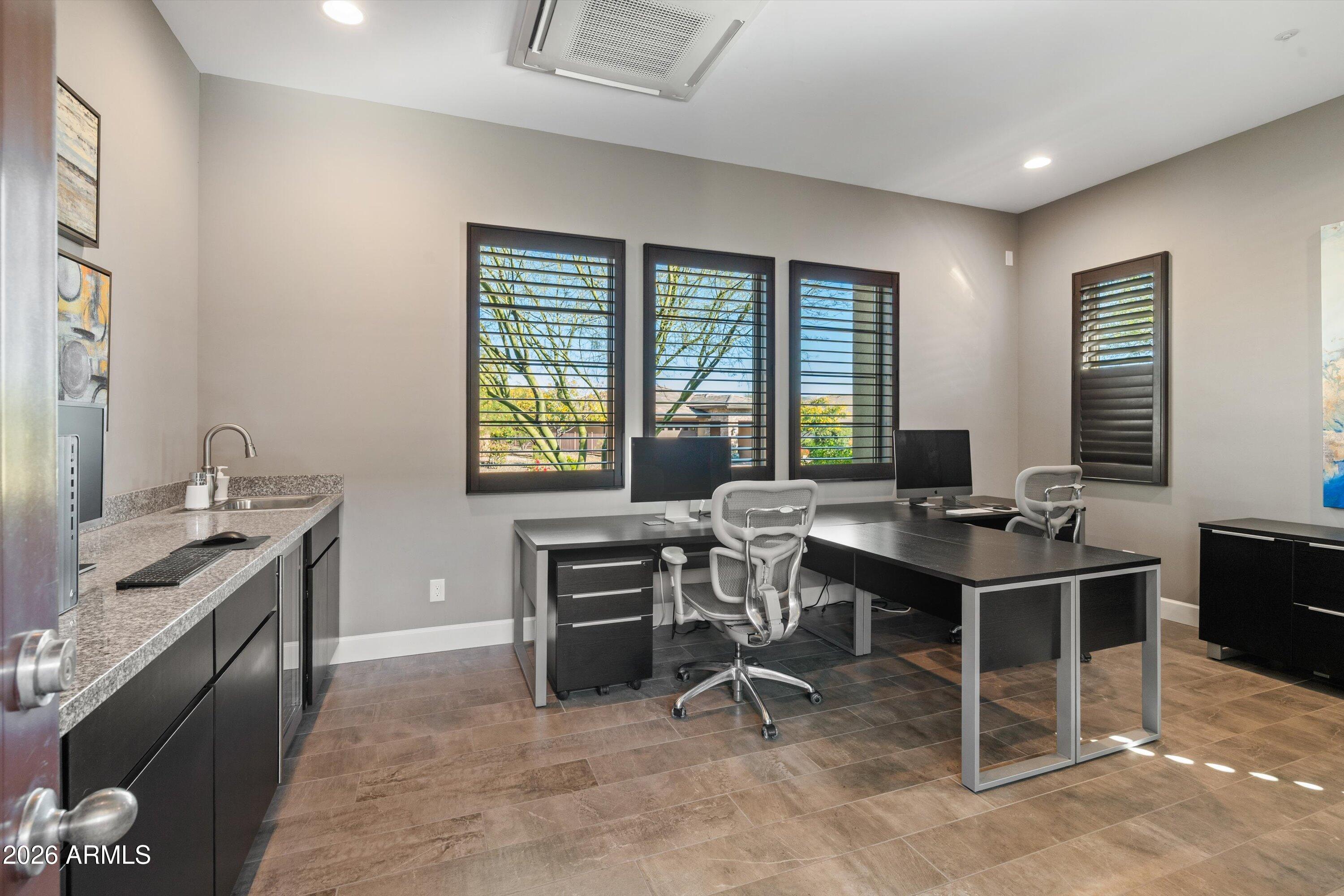 17907 East Slide Rock Drive Rio Verde, AZ 85263 - Photo 47 of 82 a view of a workspace with furniture and a window