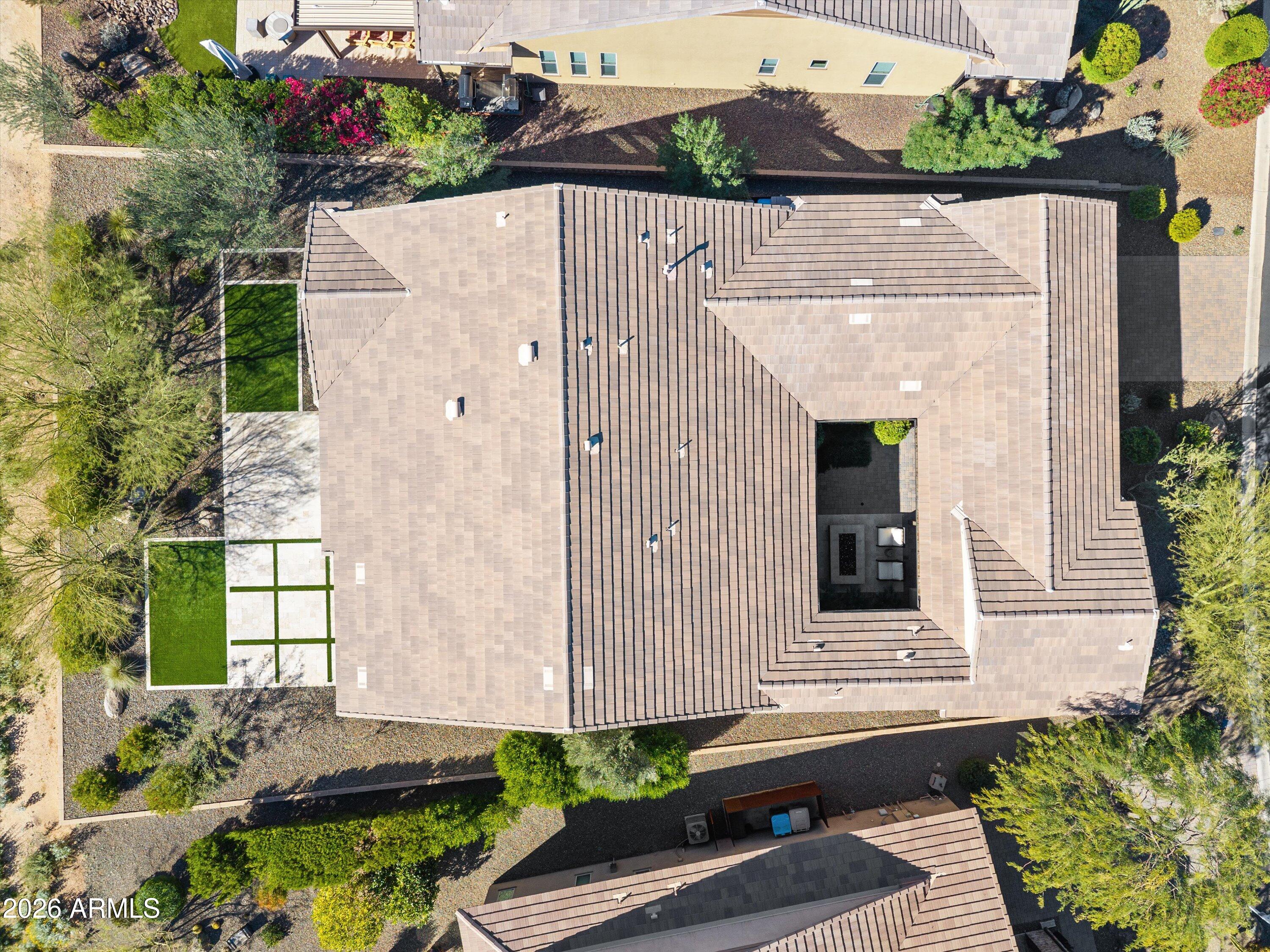 17907 East Slide Rock Drive Rio Verde, AZ 85263 - Photo 66 of 82 a aerial view of a house with a yard and potted plants