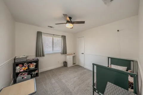 a bedroom with furniture and a chandelier