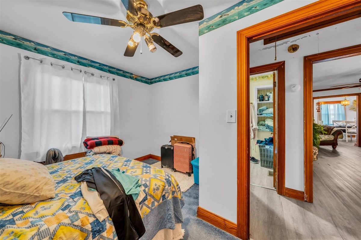 3133 Academy Road Portland, TN 37148 - Photo 15 of 24 a bedroom with a bed and wooden floor