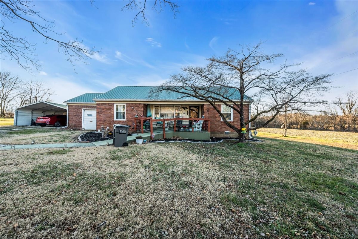 3133 Academy Road Portland, TN 37148 - Photo 2 of 24 a front view of a house with a yard