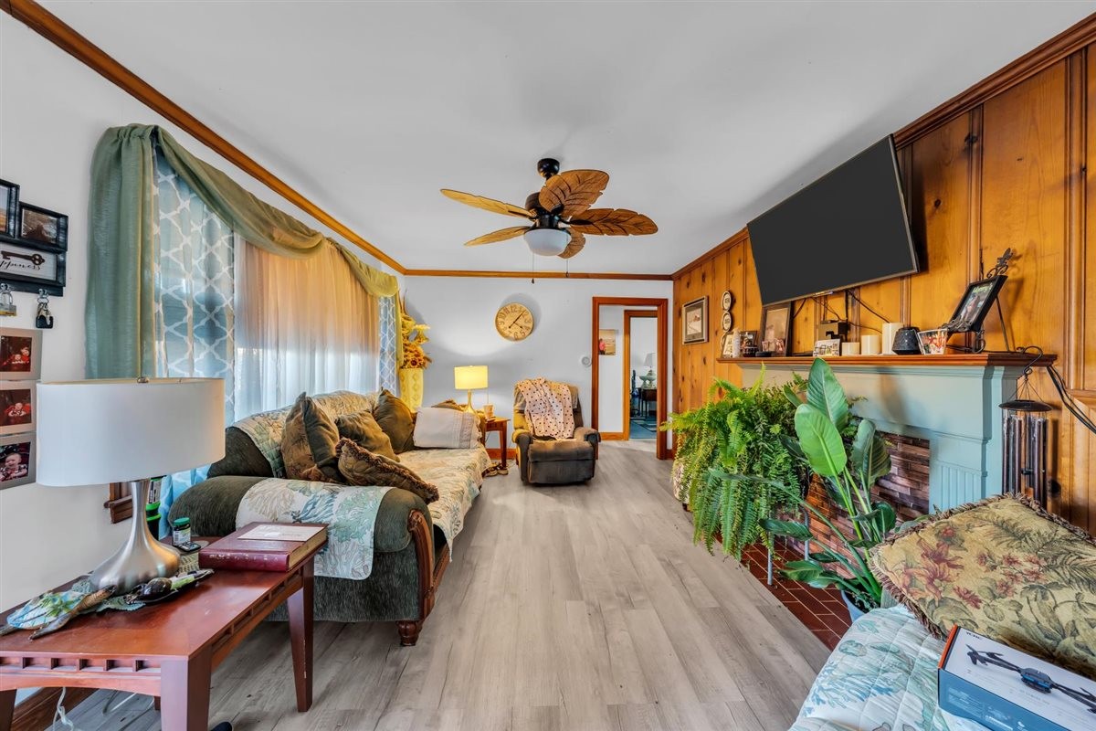 3133 Academy Road Portland, TN 37148 - Photo 5 of 24 a living room with furniture flowerpot and a chandelier