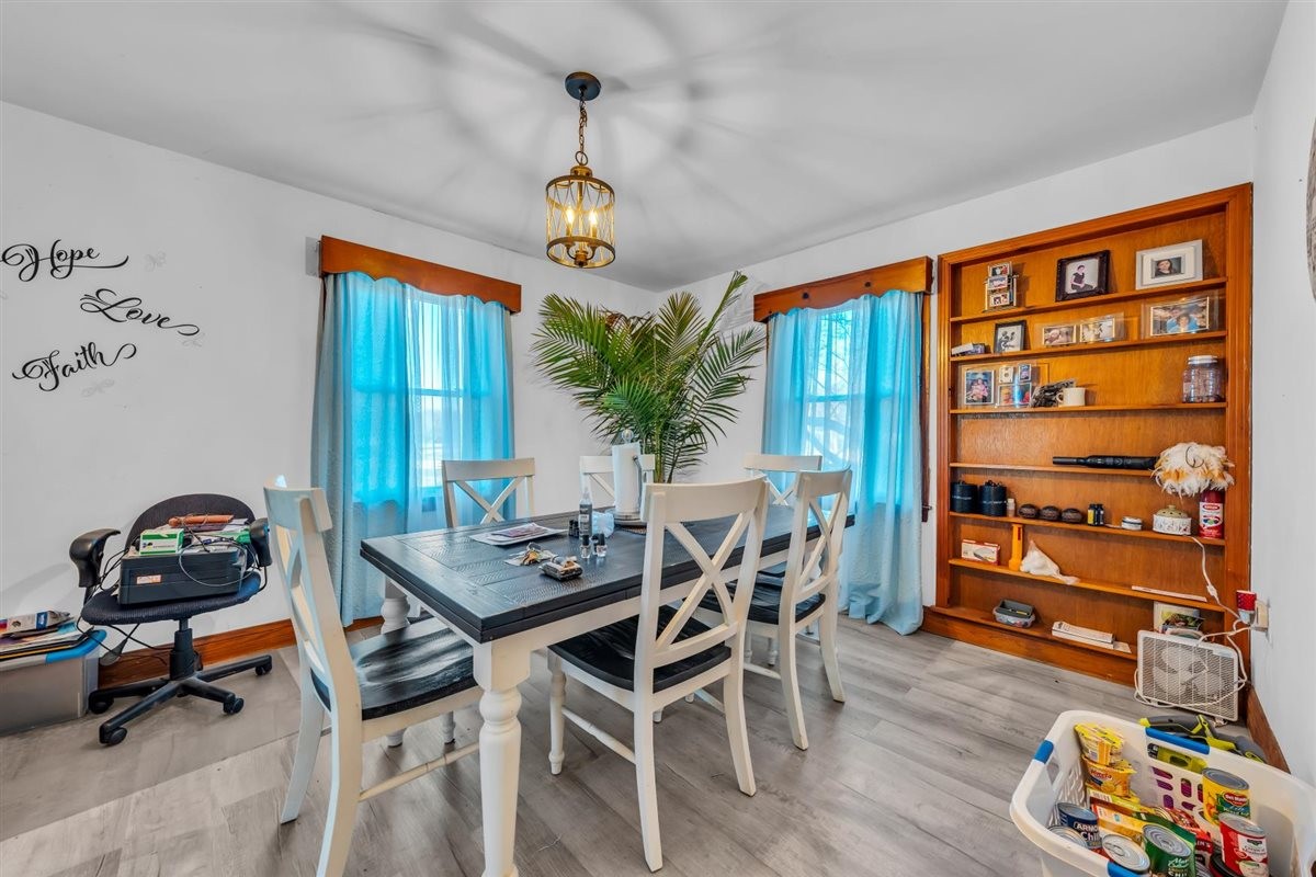 3133 Academy Road Portland, TN 37148 - Photo 7 of 24 a view of a dining room with furniture and wooden floor