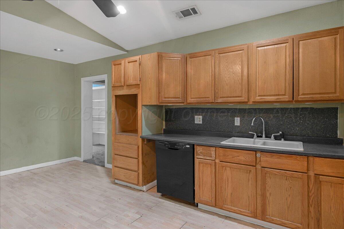 1403 South Hughes Street Amarillo, TX 79102 - Photo 15 of 54 a kitchen with a sink and cabinets