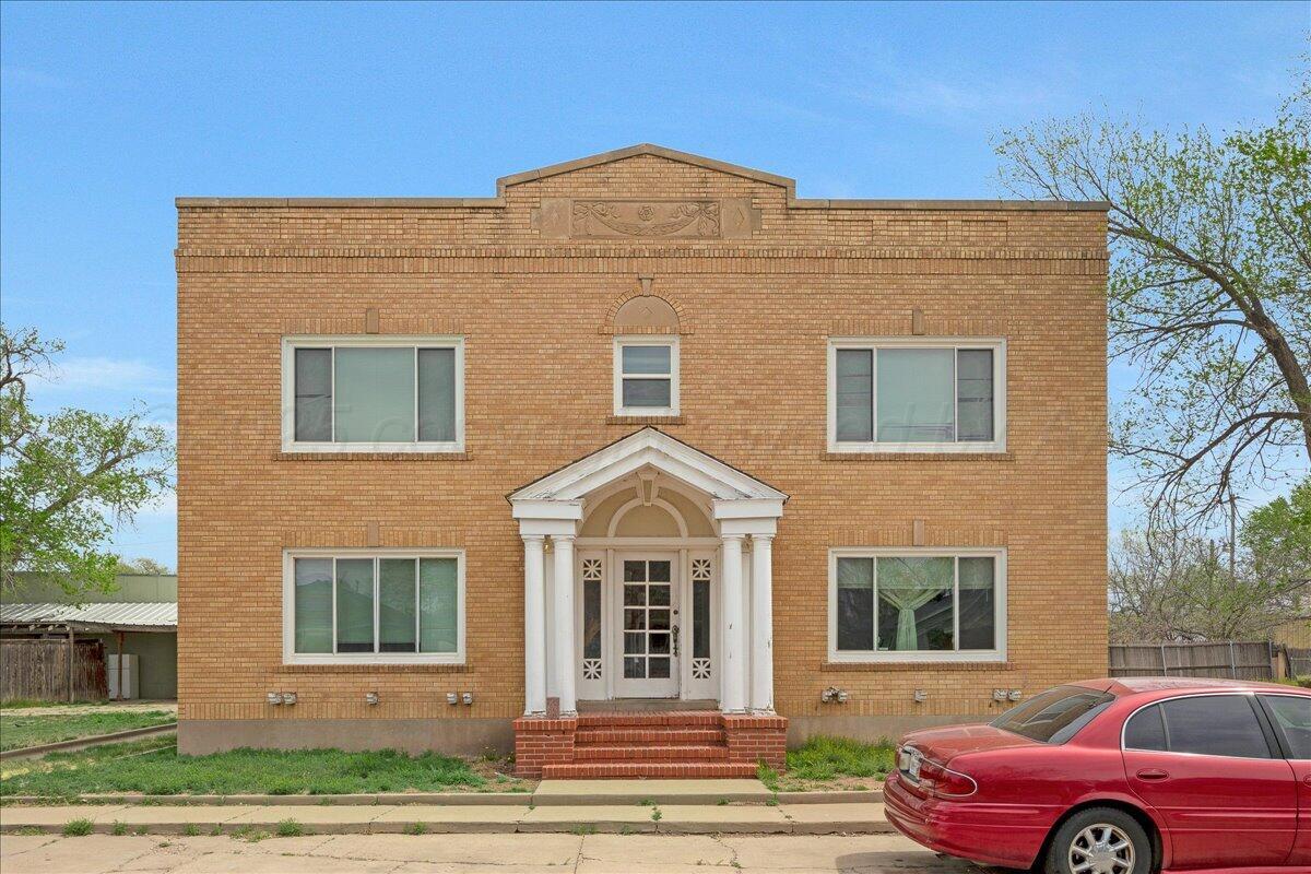 1403 South Hughes Street Amarillo, TX 79102 - Photo 3 of 54 a front view of a house with a yard