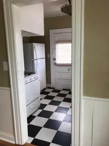 a view of a livingroom with a ceiling fan and a window
