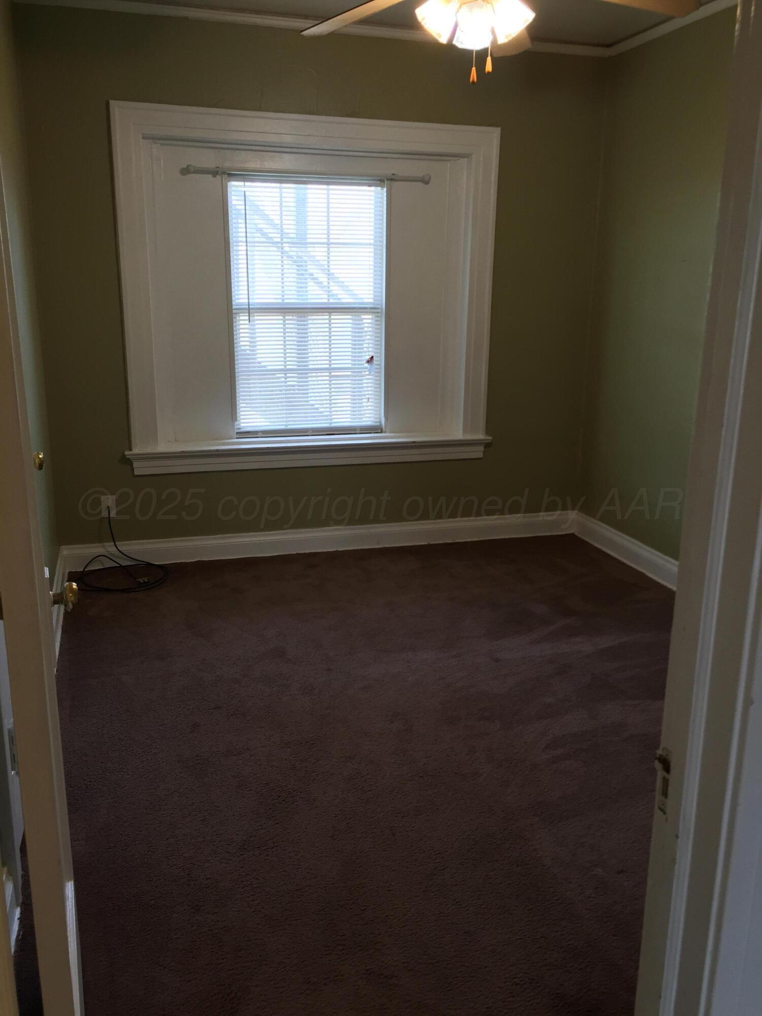 1403 South Hughes Street Amarillo, TX 79102 - Photo 40 of 54 a view of a window in an empty room