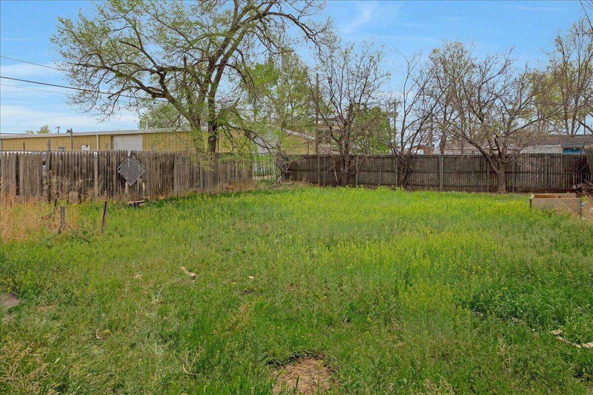 1403 South Hughes Street Amarillo, TX 79102 - Photo 49 of 54 a view of a backyard with large trees