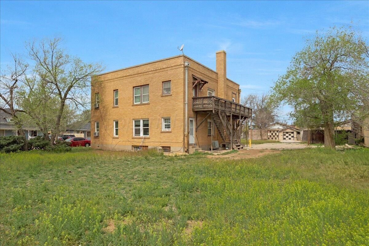 1403 South Hughes Street Amarillo, TX 79102 - Photo 8 of 54 a view of a house with a yard