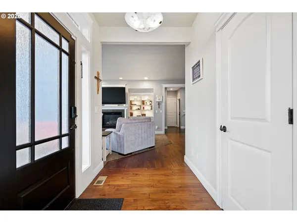 a view of a living room with a wooden floor