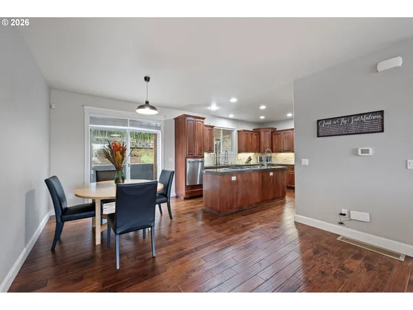 a kitchen with a table and chairs