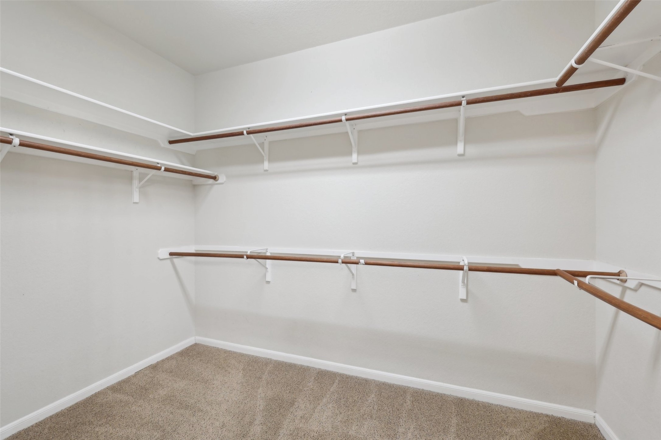 2948 Grimes Ranch Road Austin, TX 78732 - Photo 26 of 40 Walk in closet with dark colored carpet