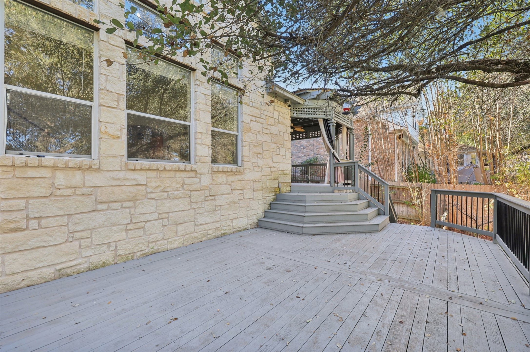 2948 Grimes Ranch Road Austin, TX 78732 - Photo 34 of 40 Wooden terrace featuring fence.