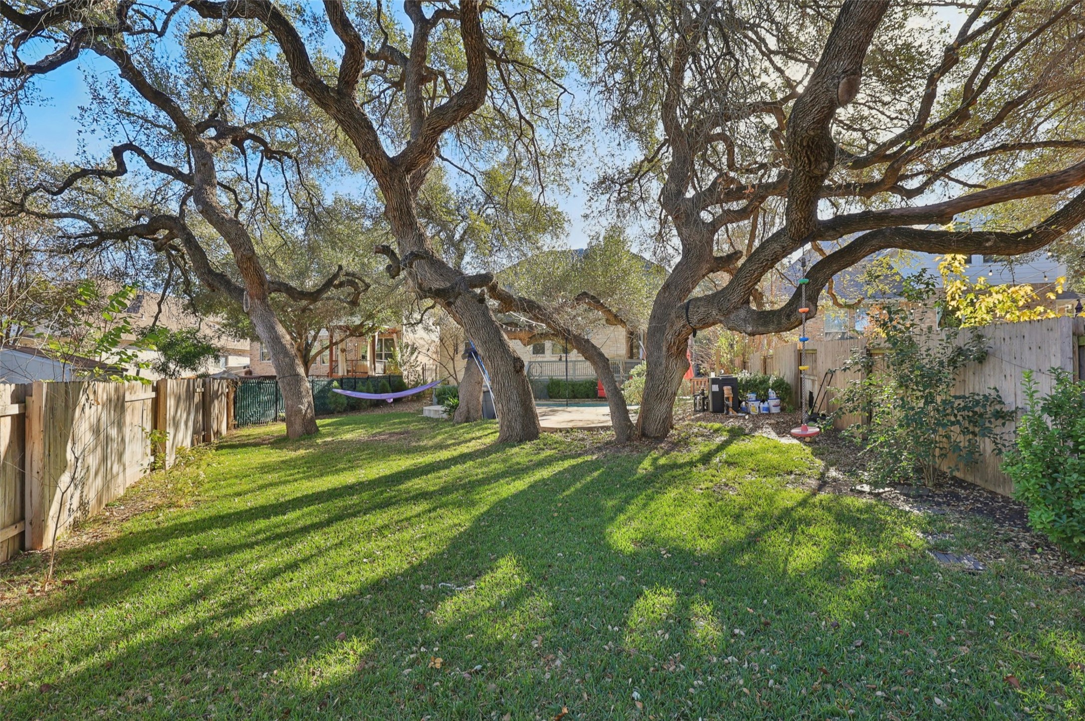 2948 Grimes Ranch Road Austin, TX 78732 - Photo 40 of 40 Expansive green lawn with established trees providing natural shade.