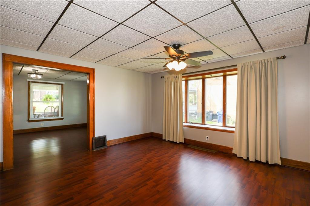 311 Center Street Slippery Rock, PA 16057 - Photo 12 of 32 an empty room with wooden floor and windows